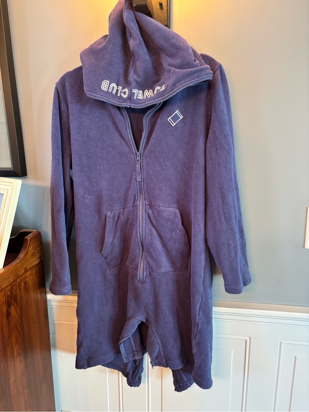 Purple towel one zip up changing romper.